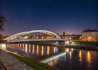 Naklejka premium Bernatka Footbridge at Night: Stunning View Over Vistula River in Krakow, Poland - High Depth of Field Photography