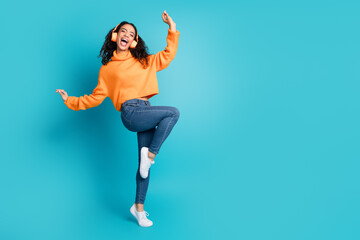 Obraz premium Full body portrait of nice young girl dance headphones empty space isolated on turquoise color background