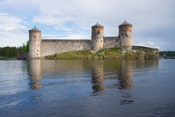 Olavinlinna fortress in the cloudy June evening. Savonlinna, Finland