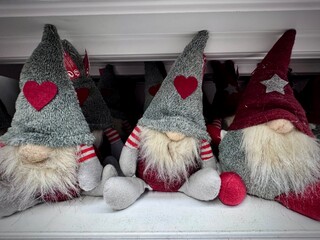 view of stuffed Christmas gnomes with their pointy hats and white beards for the Christmas holidays
