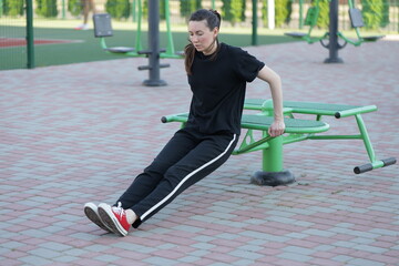 Woman doing workout exercises outside