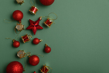 Green Christmas background with red stars, balls end different xmas toys. Christmas and Happy New Year celebration concept