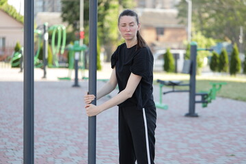 Woman doing workout exercises outside