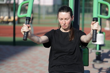 Woman doing workout exercises outside