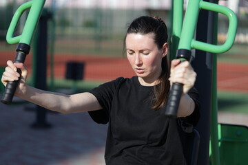 Woman doing workout exercises outside