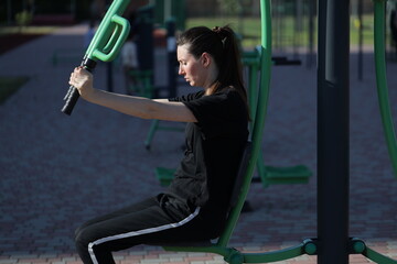 Woman doing workout exercises outside