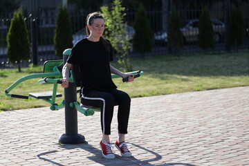Woman doing workout exercises outside