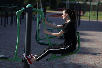 Woman doing workout exercises outside