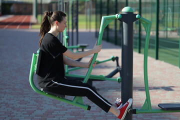 Woman doing workout exercises outside