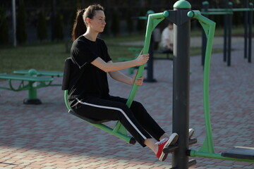 Woman doing workout exercises outside