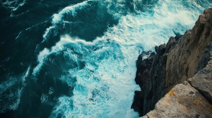 A coastal cliff with waves crashing against the rocks below