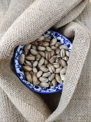 Fresh natural dried pistachios in a decorative plate 