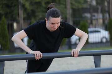 Fototapeta premium Woman doing workout exercises outside