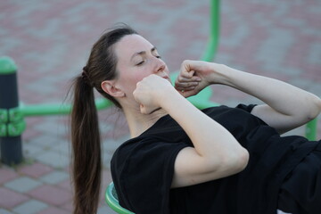 Woman doing workout exercises outside