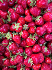 Bright and juicy fresh strawberries, a close-up of ripe berries with a rich red color.
