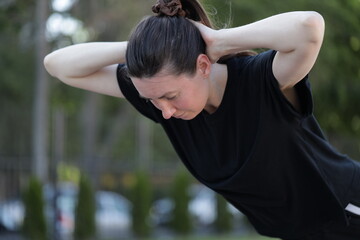 Woman doing workout exercises outside