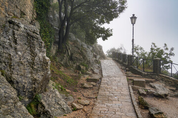 Scenic view from San Marino in foggy summer day, Italy, Europe	