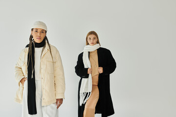 A beautiful couple, dressed in warm autumn attire, shares a joyful moment together.