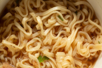 A top down view of instant ramen noodles, as a background.