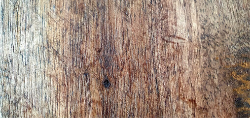 Fototapeta premium The texture of a wooden board. Wooden texture. Wooden background. Wooden plank made of mango wood. Mango board. Brown background.