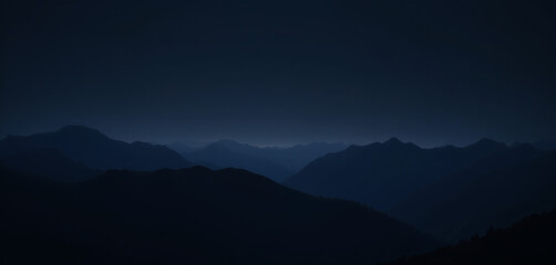 Fototapeta premium Dark Mountain Silhouettes Against a Night Sky with Subtle Light