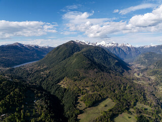 Fototapeta premium Villarrica National Reserve aerial panoramic view with snowy peaks of Cordillera de los Andes in Chile