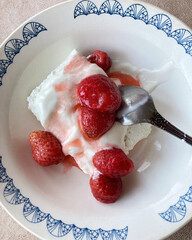ripe strawberries with cottage cheese and cream. delicious breakfast. close-up view from above