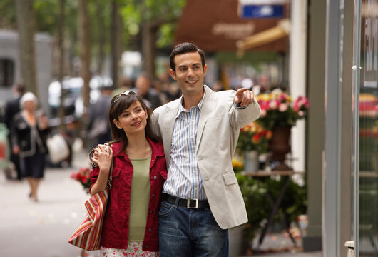 Couple Walking on Sidewalk