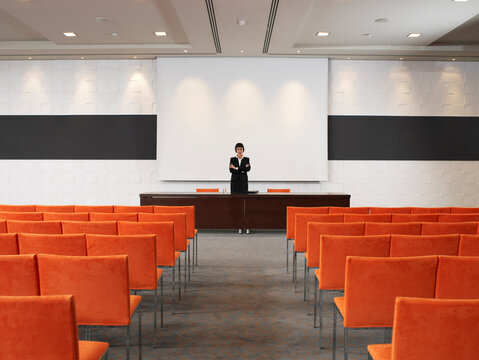 Businesswoman in Auditorium