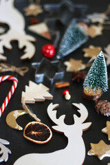 Various Christmas decorations in neutral colors on dark background. Selective focus.