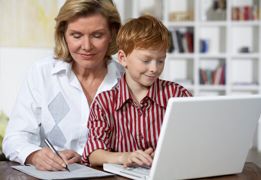 Grandmother and Grandson Using Laptop