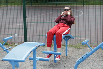 Fototapeta premium Woman exercising or doing workout session outside 