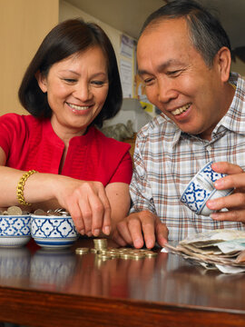 Couple Counting Coins in Restaurant