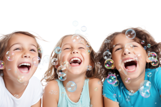 Three friends with radiant smiles blowing bubbles in the air, creating a joyful atmosphere isolated on white background