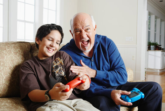 Grandfather and Grandson Playing Video Games