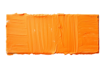 Orange block of paint with rough brush strokes and visible texture isolated on white background