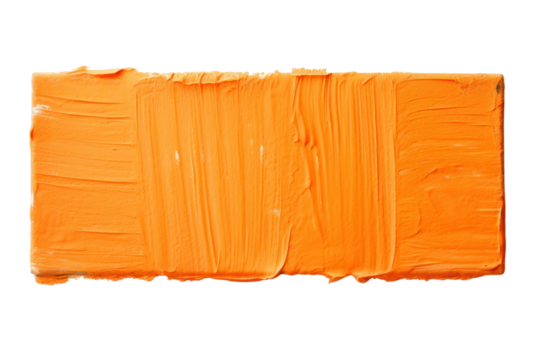 Orange block of paint with rough brush strokes and visible texture isolated on white background
