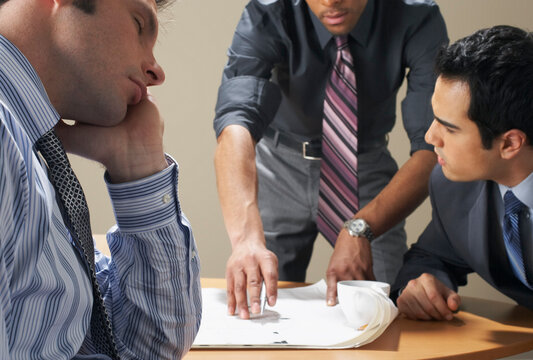 Businessman Sleeping in Meeting