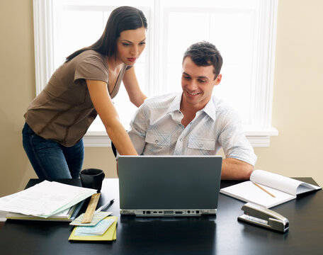 Couple Paying Bills Online
