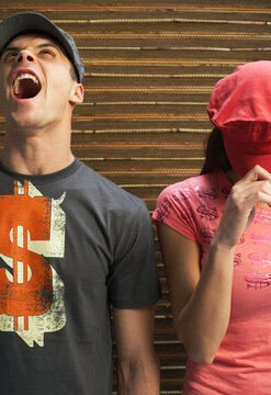 Man Yelling and Woman Covering Face