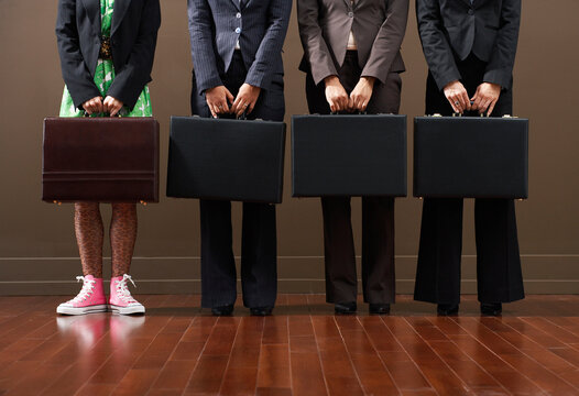 Businesswomen Holding Briefcases