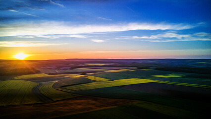 Aerial view of the countryside with the rising sun and oil painting effect