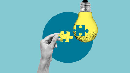 Business creativity, inspiration and creative thinking concept. Finishing lightbulb with jigsaw...