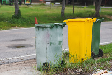 Green plastic trash cans in public places