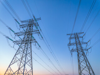 High voltage electricity tower and sky at sunset