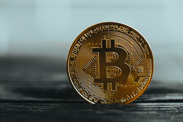 Close-up of Bitcoin on a reflective surface