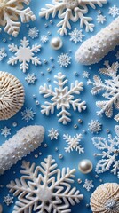 Beautiful arrangement of delicate snowflakes and festive decorations on a solid blue background, perfect for winter celebrations or holiday crafts