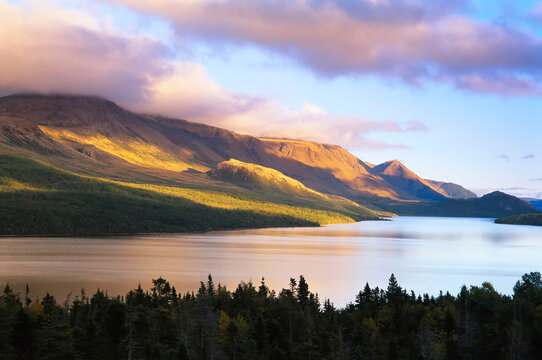 View of the rugged landscape in Gros Morne National Park at twilight from Trout River Pond Trail, Newfoundland, Canada; Trout River, Newfoundland and Labrador, Canada