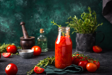 Fresh homemade tomato sauce in rustic setting