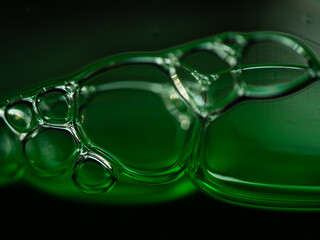 Green water bubbles close up macro shot 